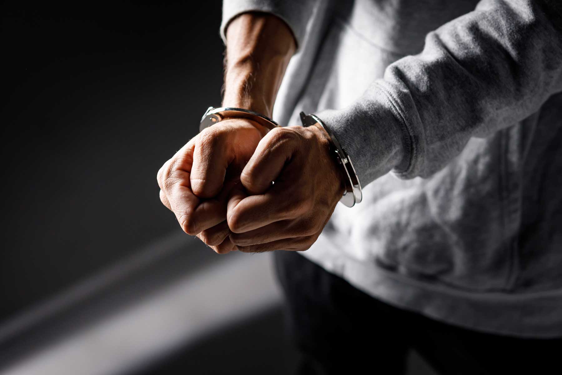 Person being handcuffed for domestic violence in Orange County