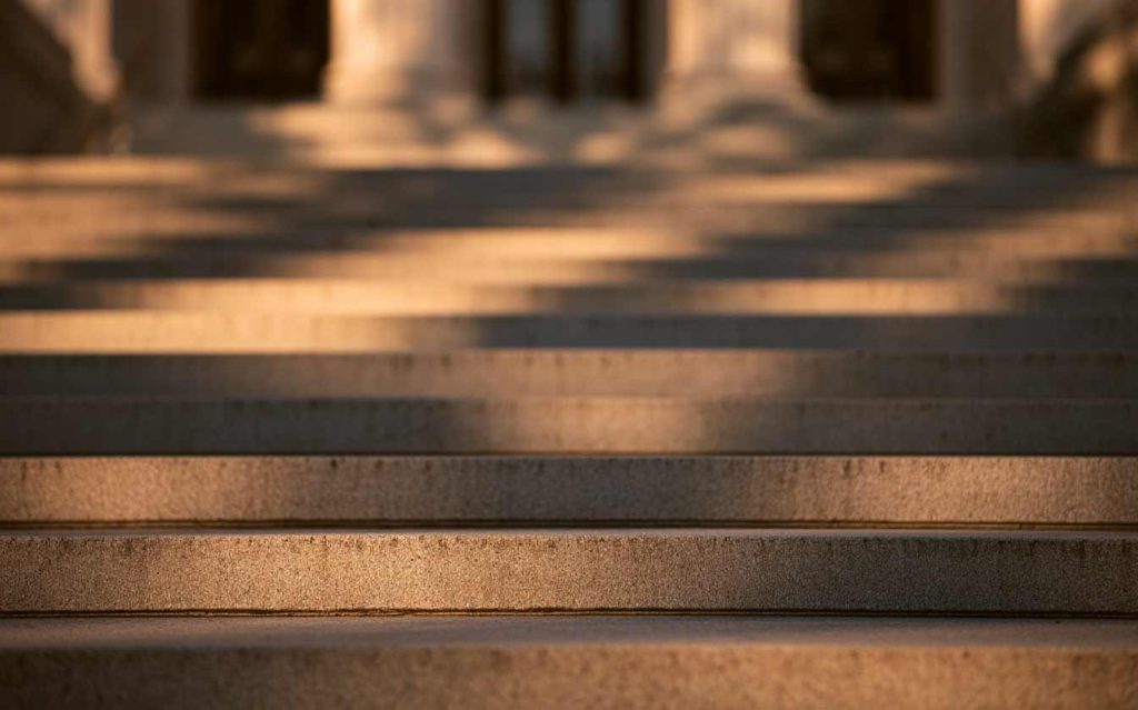 Courthouse steps in morning light, representing an arraignment after an arrest in Santa Ana